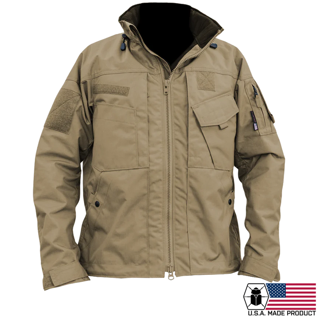 Kitanica MARK VI Jacket - USA Made. A tan tactical utility jacket with a full front zipper, multiple flap pockets, and velcro patches, shown on a white background 